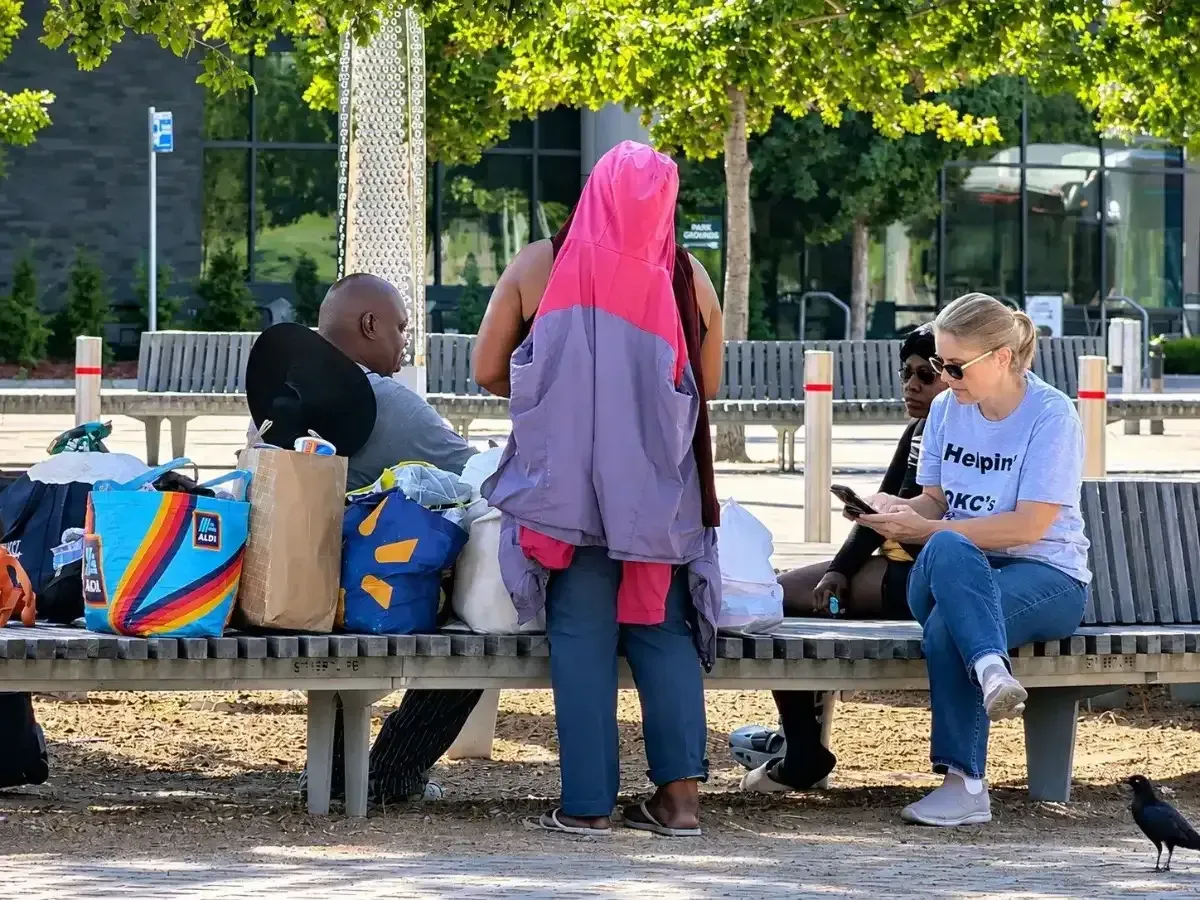 John's Dignity volunteers sharing outreach supplies with neighbors at park benches in Oklahoma City