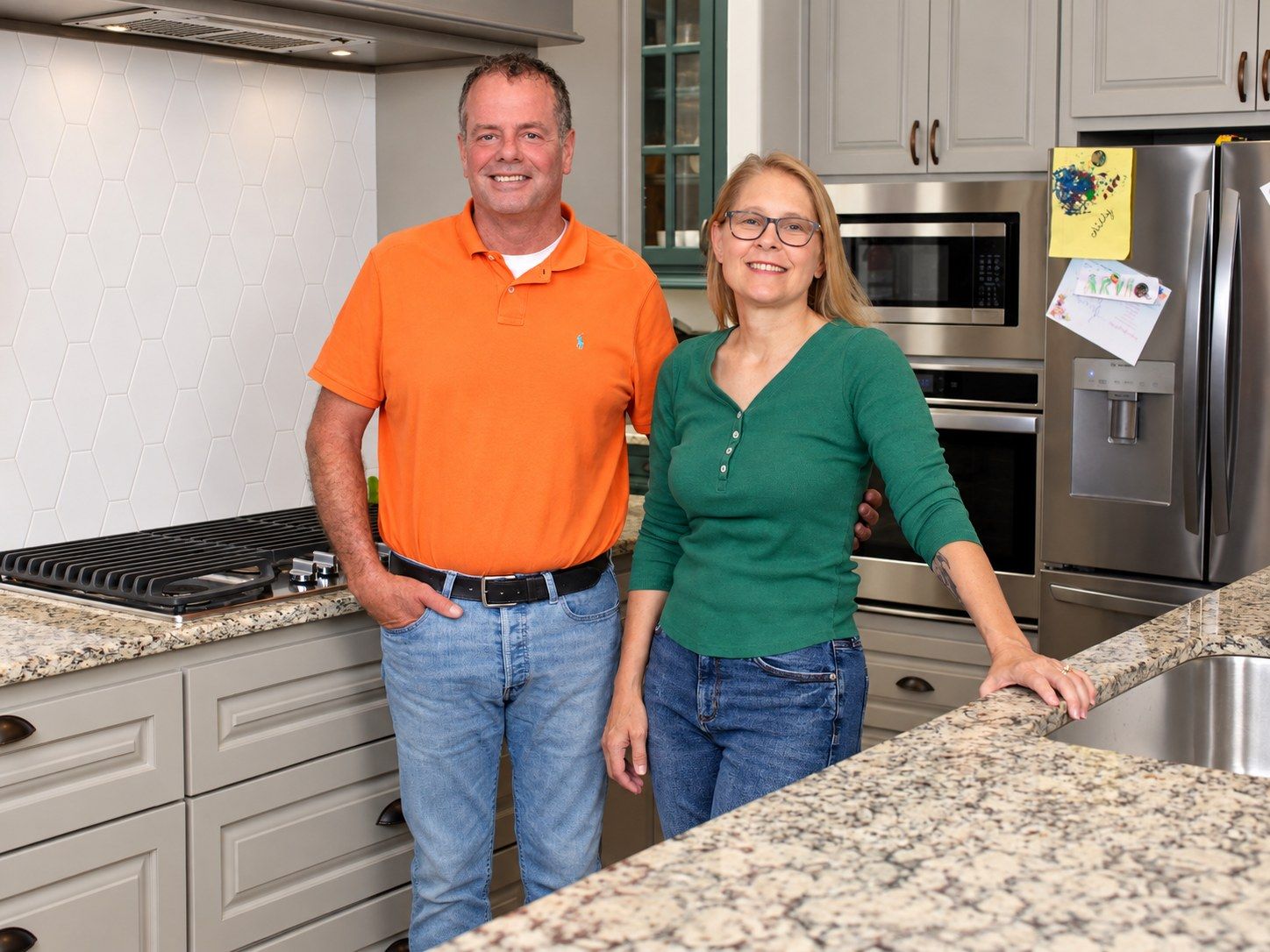 John's Dignity Inc. founders smiling together in their kitchen in the Oklahoma City area