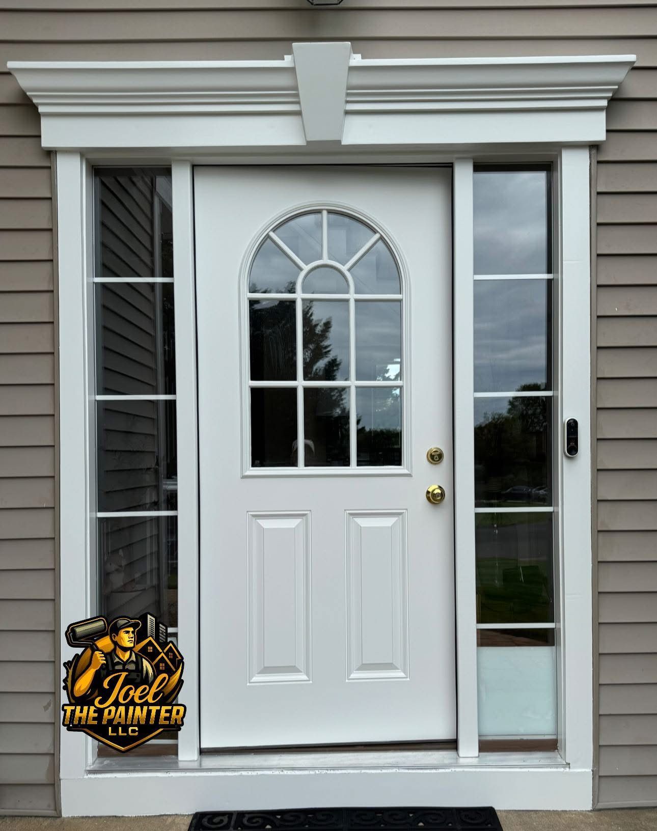 White front door with arched window and sidelights, set in beige siding.