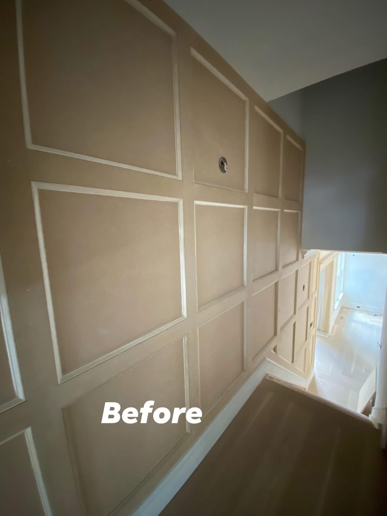 Hallway with beige paneled wall and staircase opening, labeled “Before”