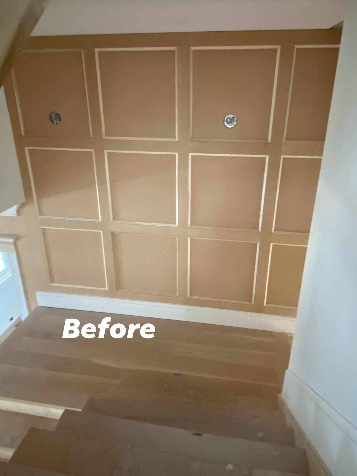 Brown paneled wall with built-in shelving and steps in front, labeled “Before”