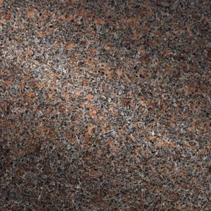 Close-up of a mottled brown, gray, and black speckled stone surface