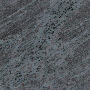 Close-up of a gray, textured snowy surface with scattered dark specks