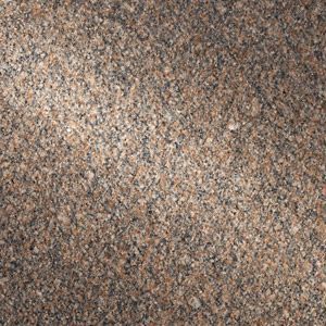 Close-up of a speckled beige, brown, and gray textured surface with a diagonal light streak
