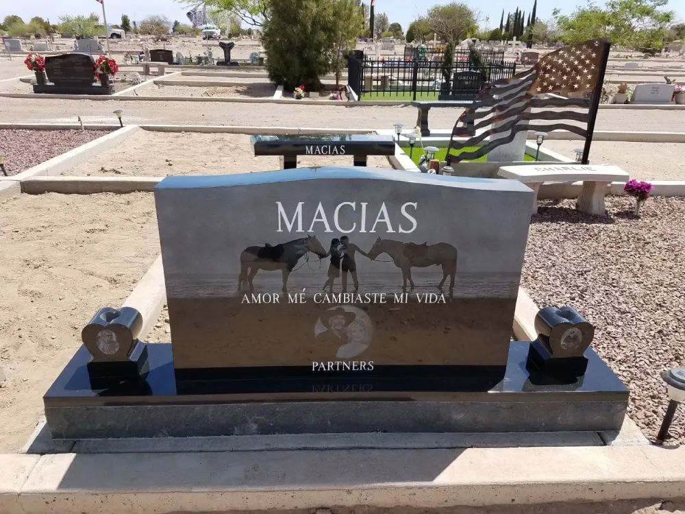 Macias family gravestone with engraved cattle in a desert cemetery