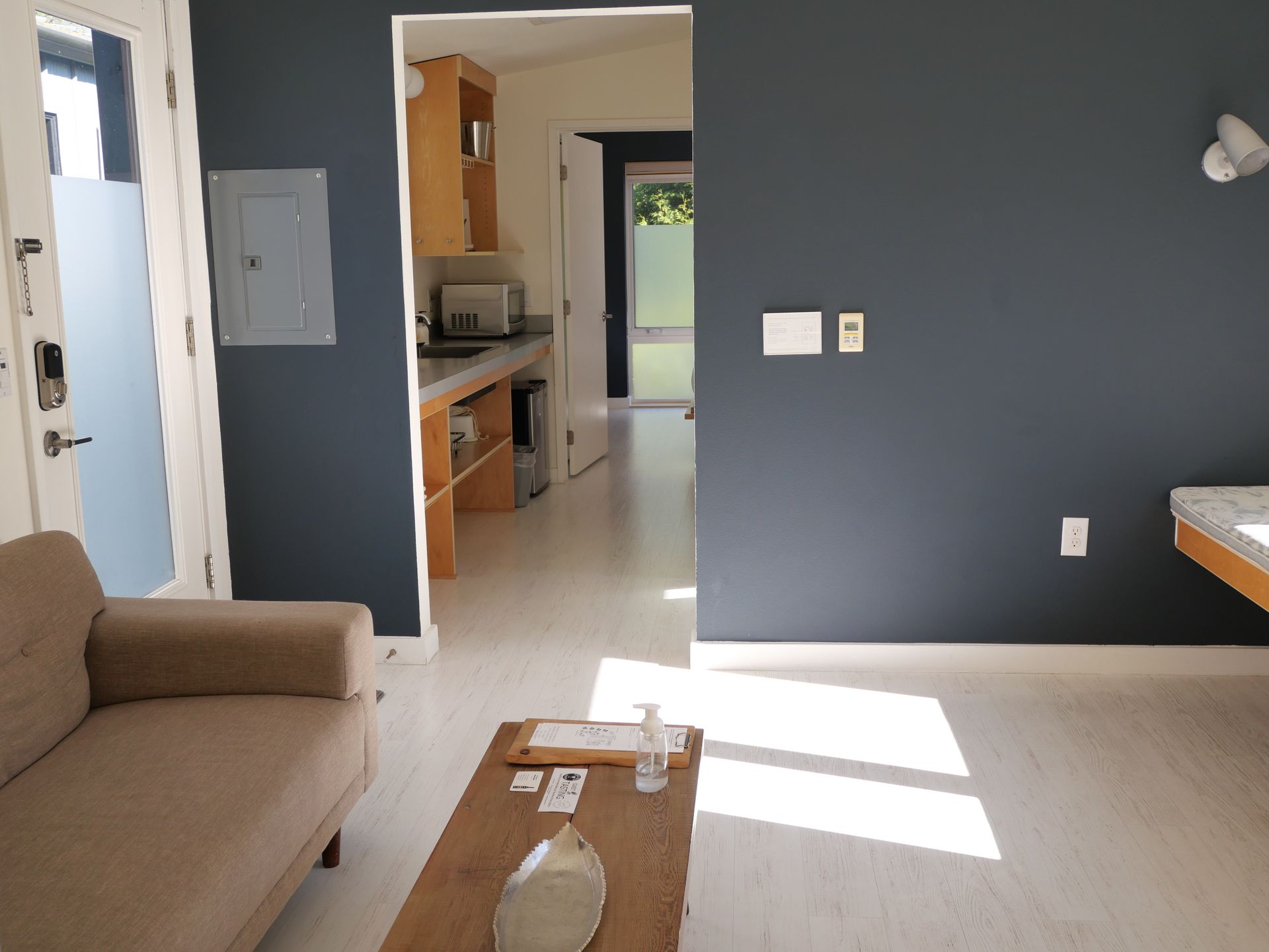 Interior of Meadow King Lodge with fireplace, oversized shower room, and modern design on Vashon Island.