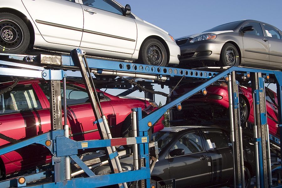 A bunch of cars are stacked on top of each other
