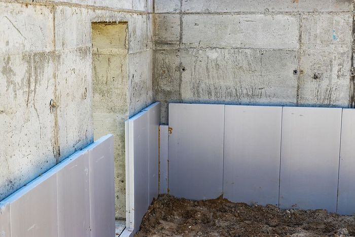 a room with a wall that has been stripped off