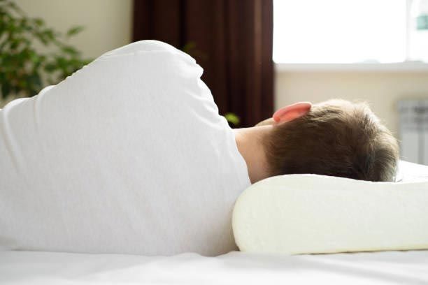 Orthopedic pillow supporting neck alignment and pain relief during sleep