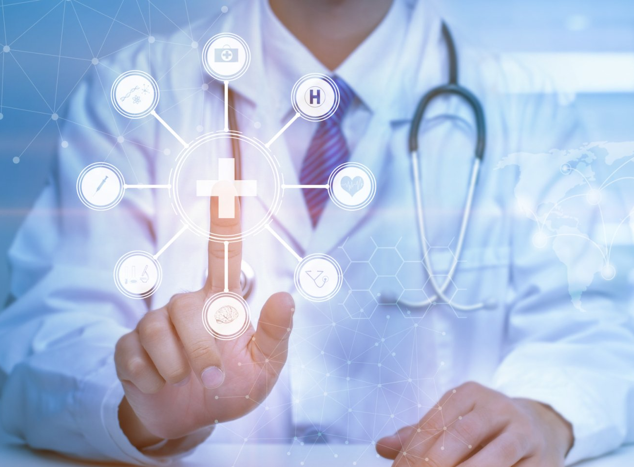 A doctor is pressing a button on a computer screen.