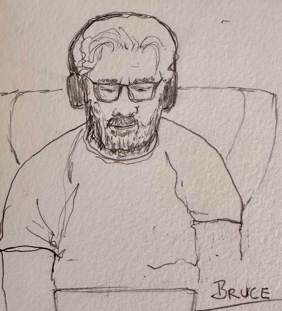 Sketch of a man wearing headphones and glasses, seated and labeled “Bruce”