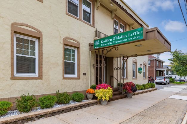 A building with a sign that says ' antique valley leather ' on it
