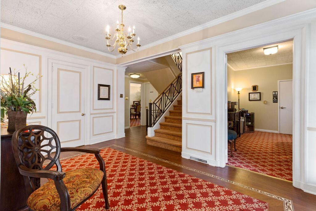 There is a staircase in the middle of the hallway.