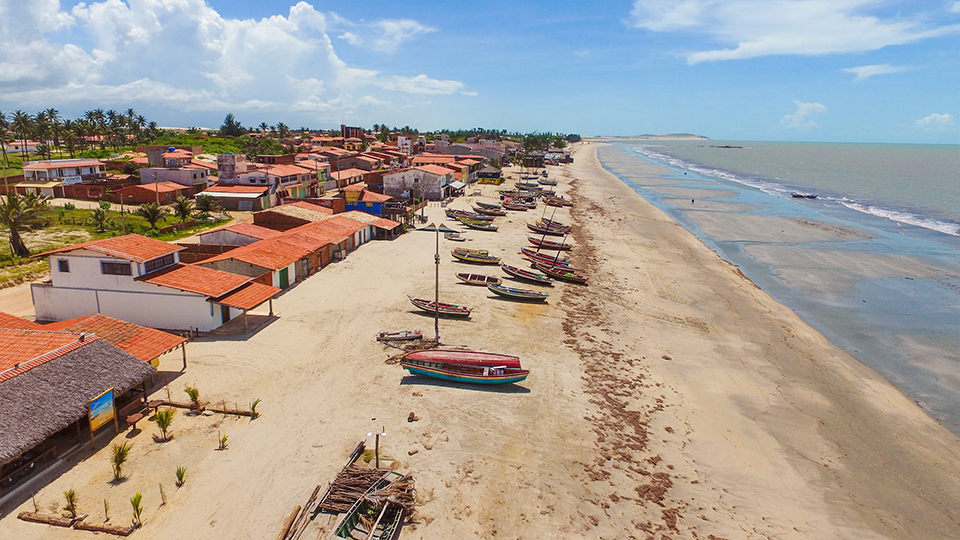 An aerial view of a beach with boats on it