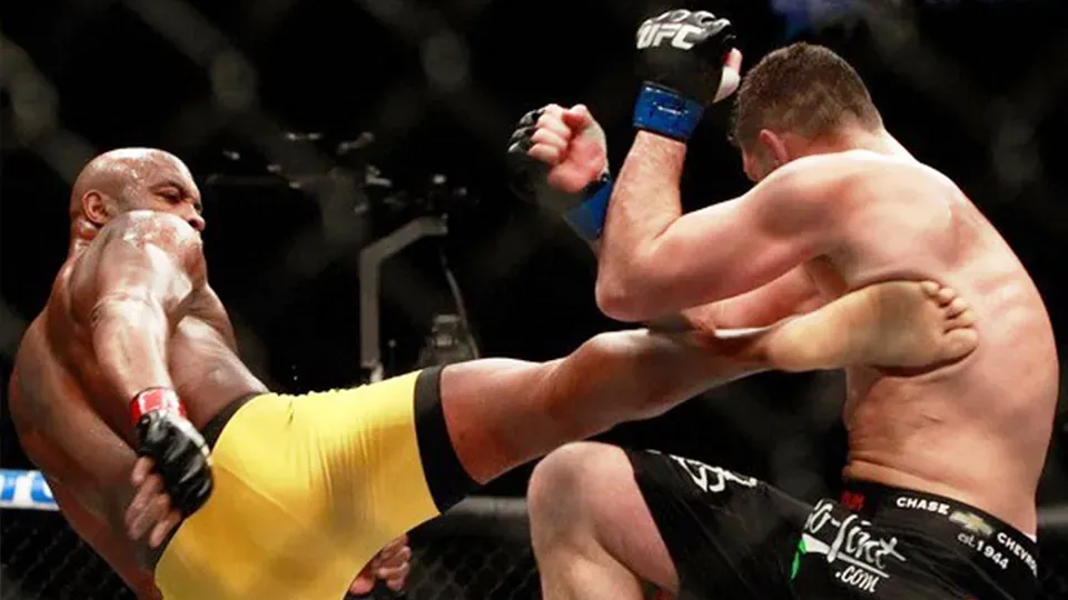 Two men are fighting each other in a boxing ring.
