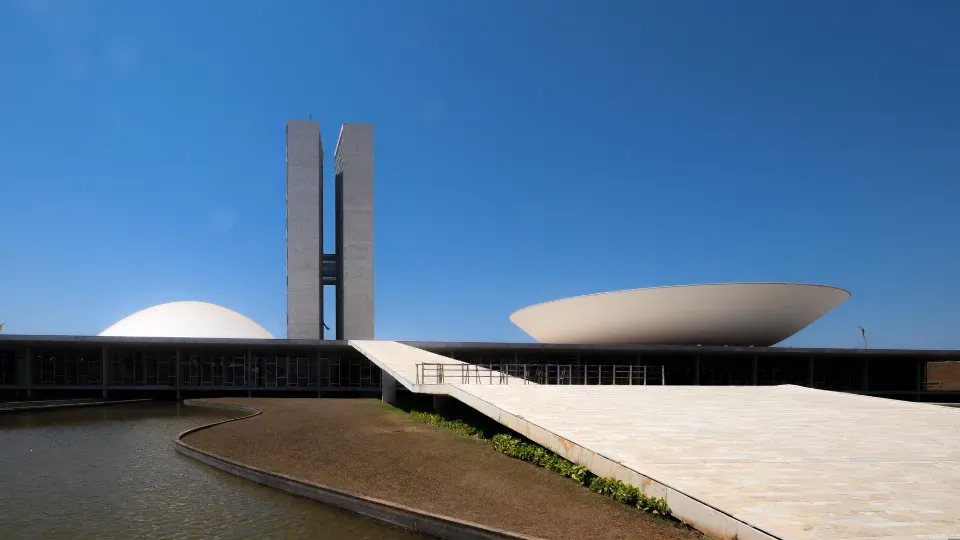 A large building with a blue sky in the background