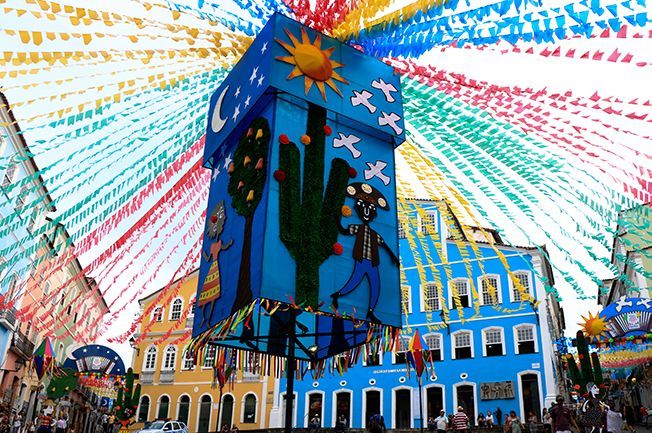 Paper decorations over the streets of Salvador with colorful motives in São João