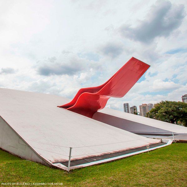 The Audiotório Ibirapuera building in São Paulo A large red sculpture on top of a white building
