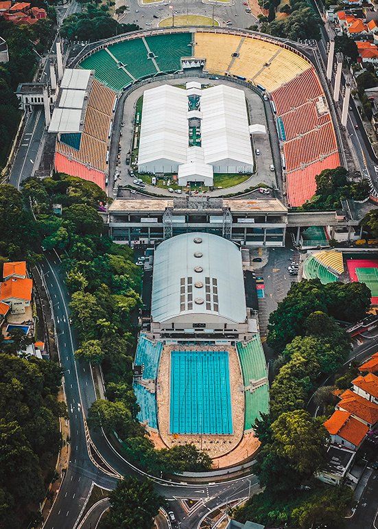 An aerial view of Pacaembu stadium with a big tent built on top of the ground.