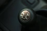 Manual transmission gear shift knob with a shift pattern in a car interior