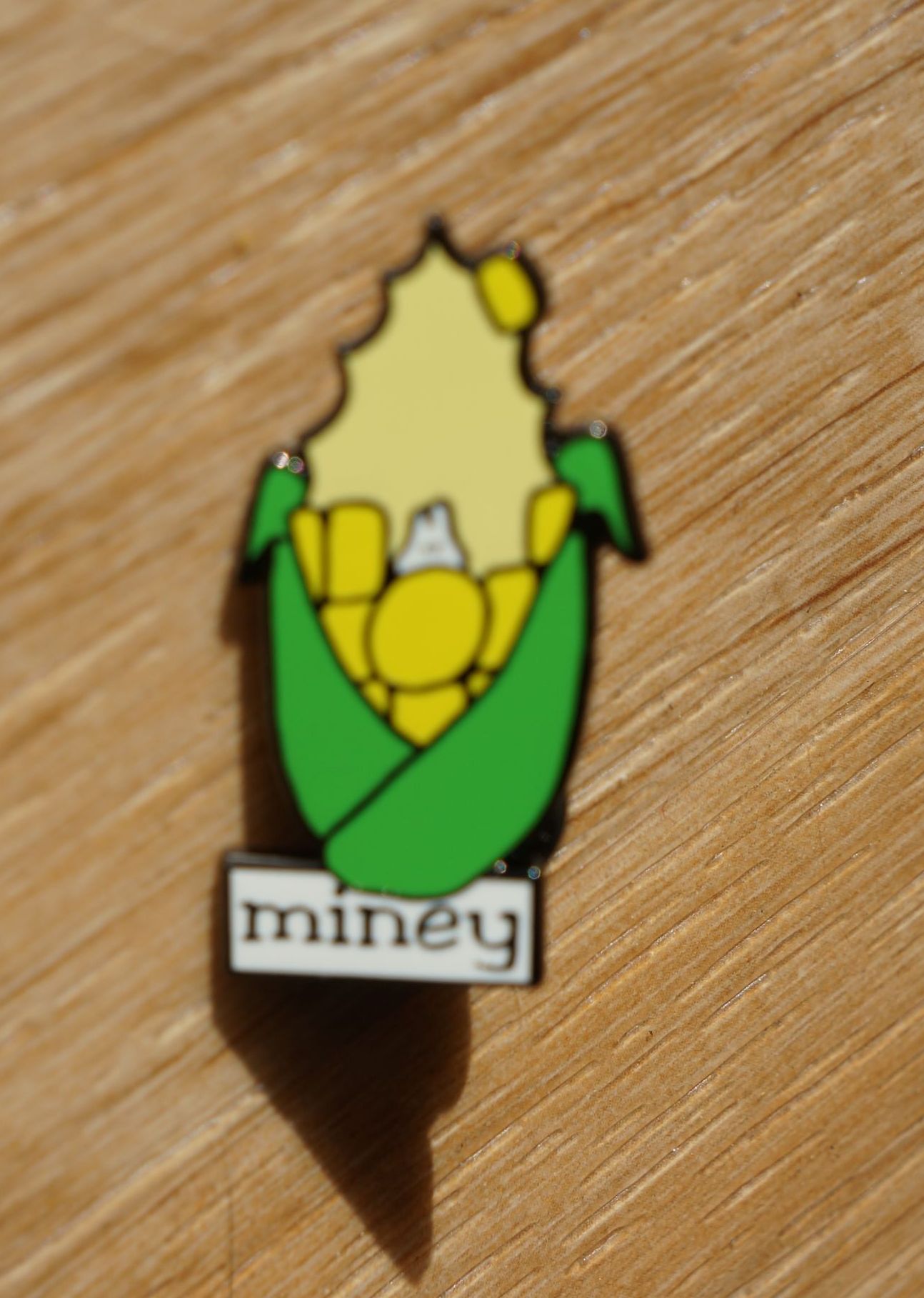 Enamel pin of Miney from the Great Vermont Corn Maze