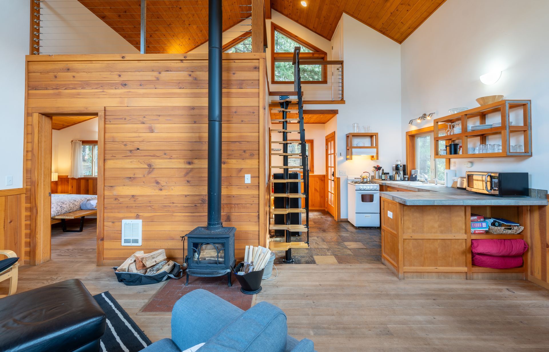 There is a wood stove in the middle of the room.