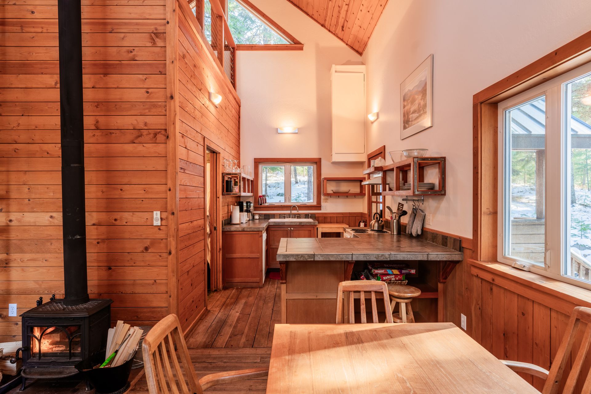 There is a wood stove in the middle of the room.