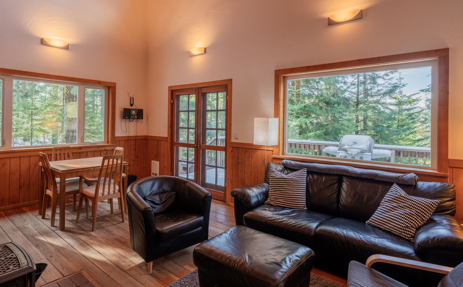 A living room with a couch , chairs , and a fireplace.