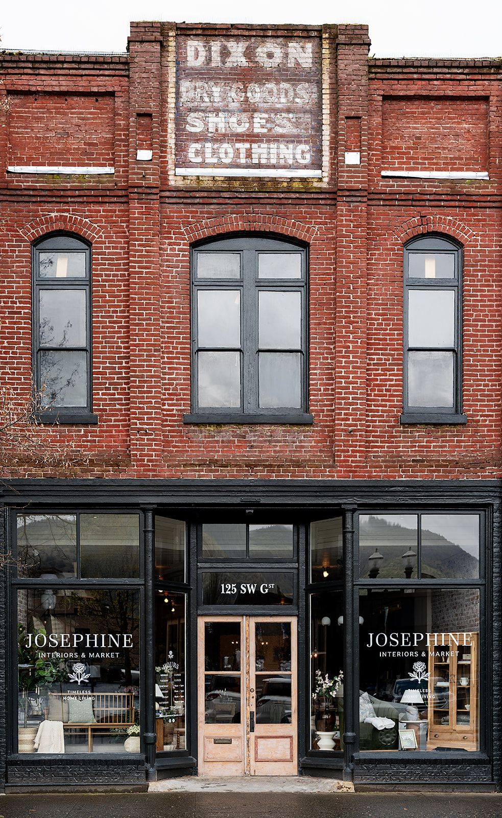 A brick building with a sign that says dixon on it