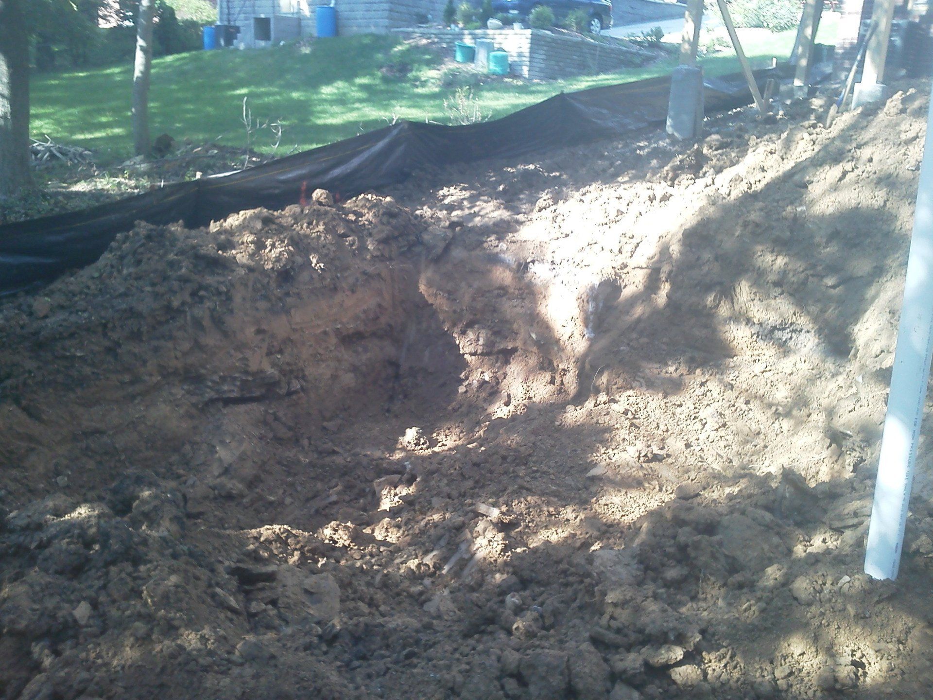 A pile of dirt is sitting in front of a house