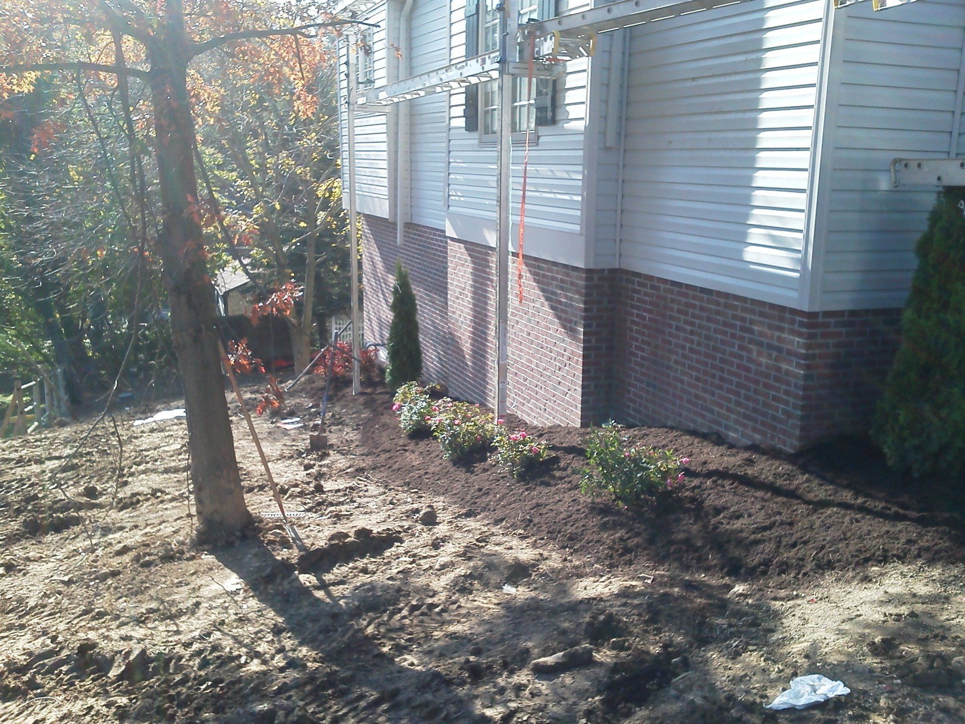 A house with a lot of dirt in front of it
