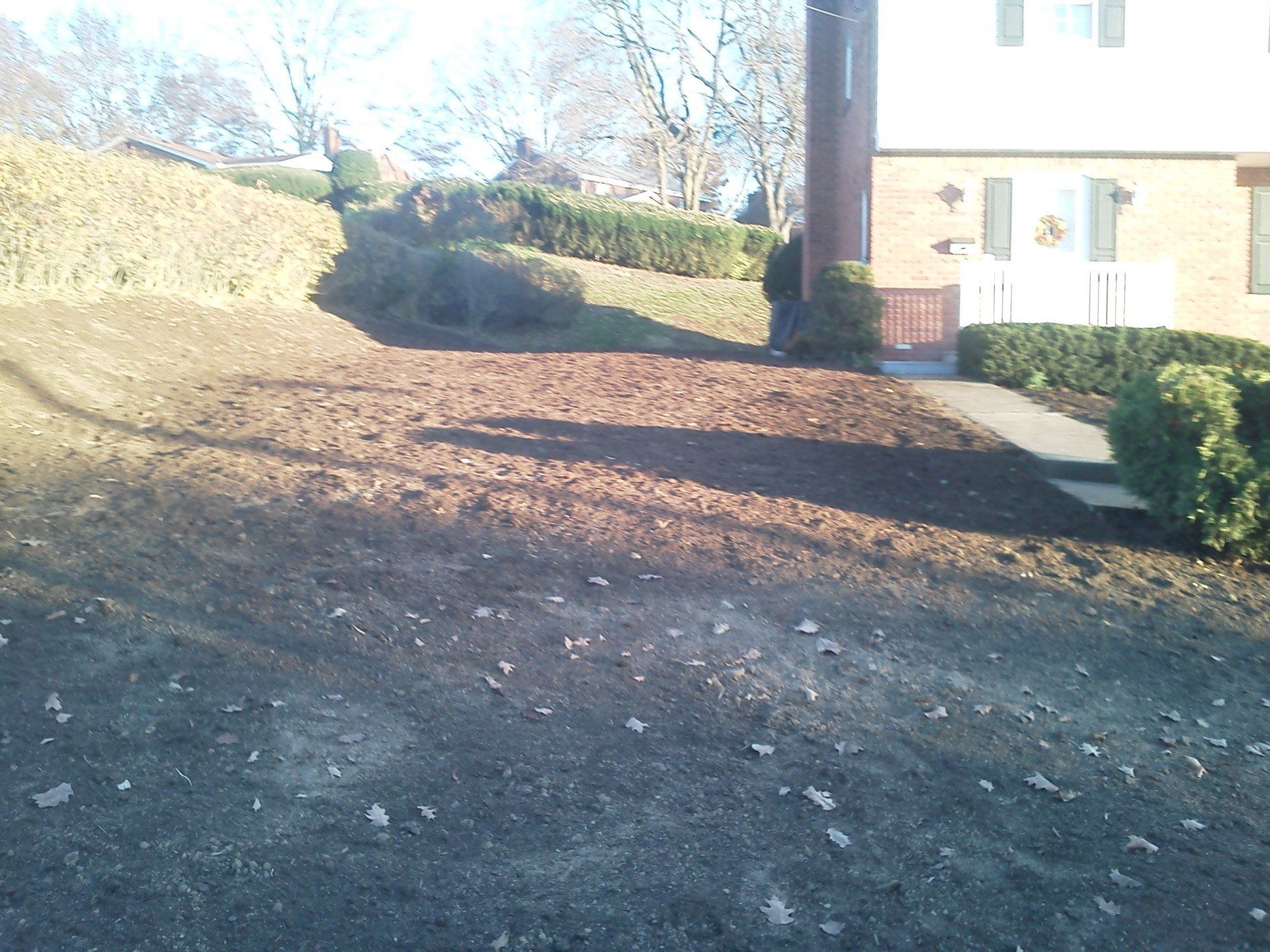 A house with a lot of dirt in front of it