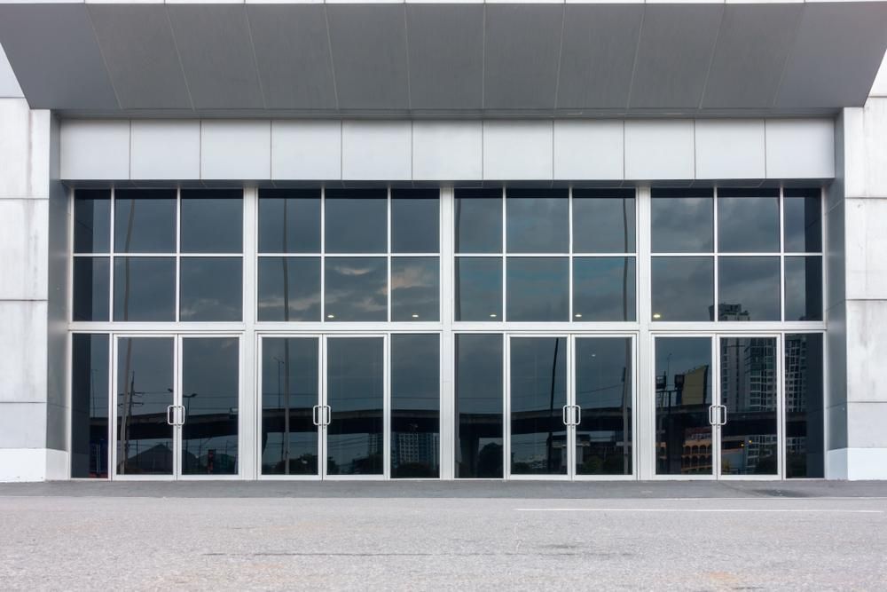 Large Building With a Lot of Windows and Doors — G & A Glass & Aluminium in Mackay, QLD