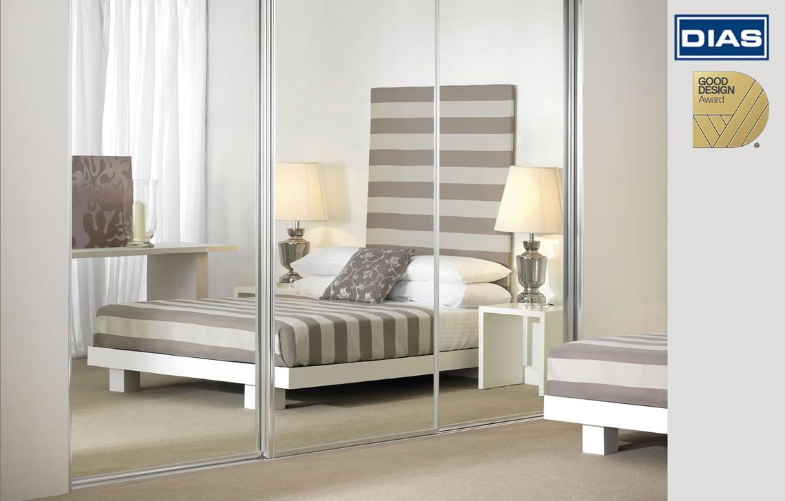 Bedroom with Large Wooden Wardrobe and Sliding Doors — G & A Glass & Aluminium in Cluden, QLD