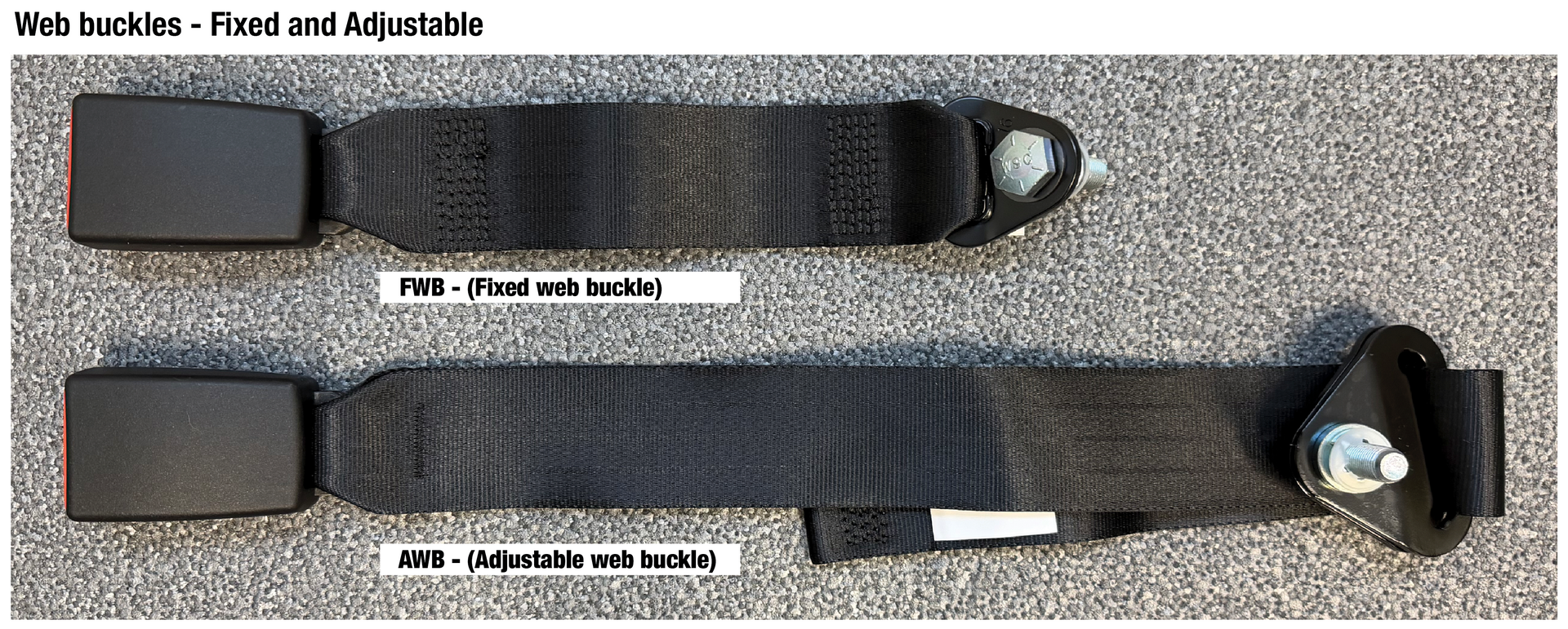 Two black webbing straps with metal buckles laid side by side on a gray carpet. Two black webbing straps with metal buckles laid side by side on a gray carpet.