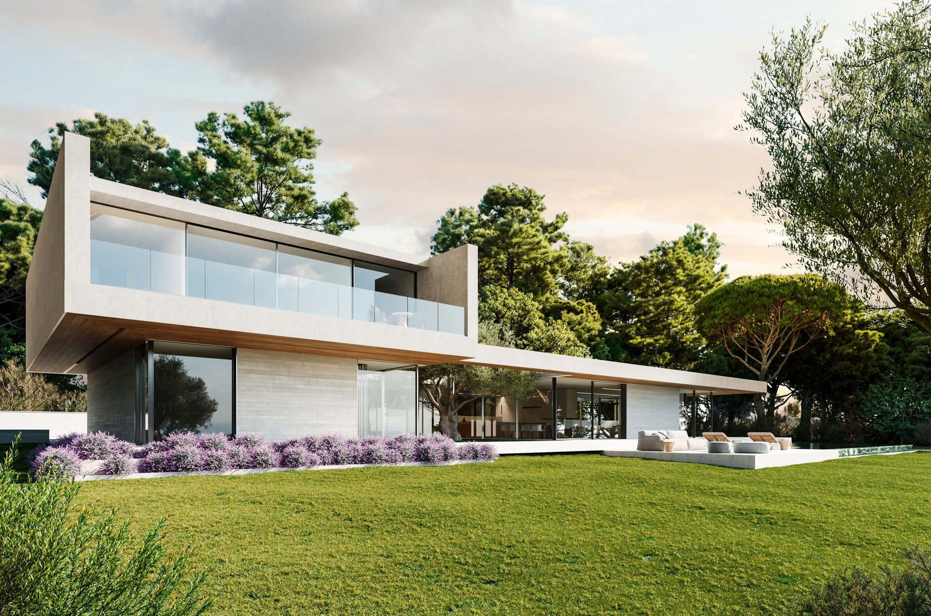 Casa moderna de dos plantas con fachada blanca, grandes ventanales y césped verde al atardecer.