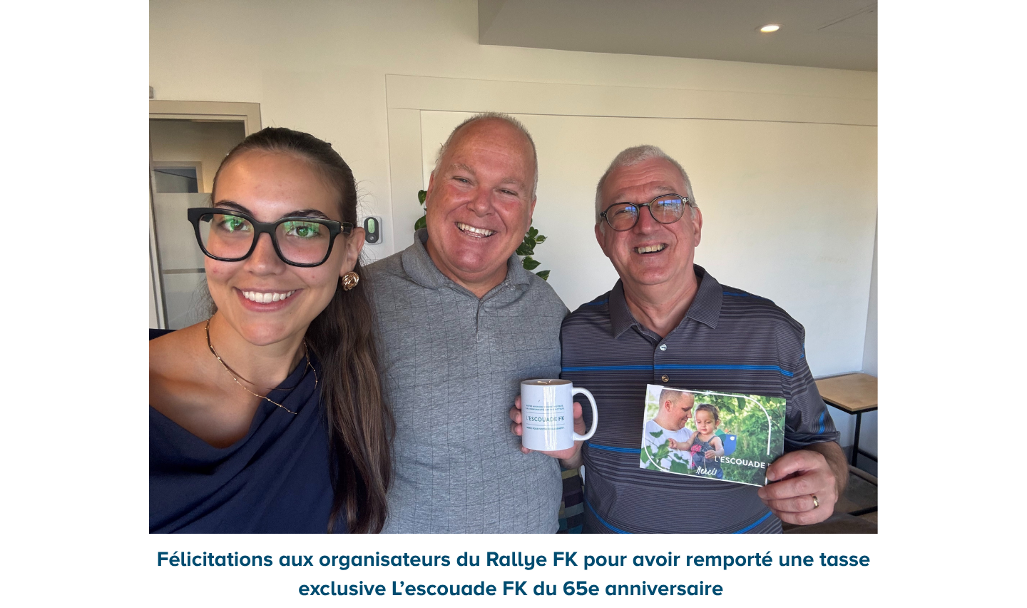 Event organizers holding 65th anniversary mug and thank you card.