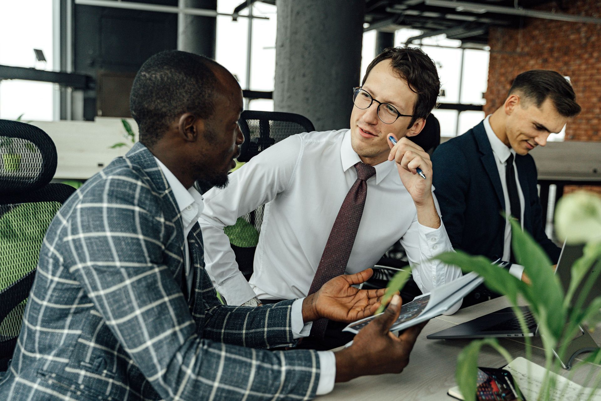 Attorney reviewing M&A disclosure schedules and a purchase agreement during transaction preparation