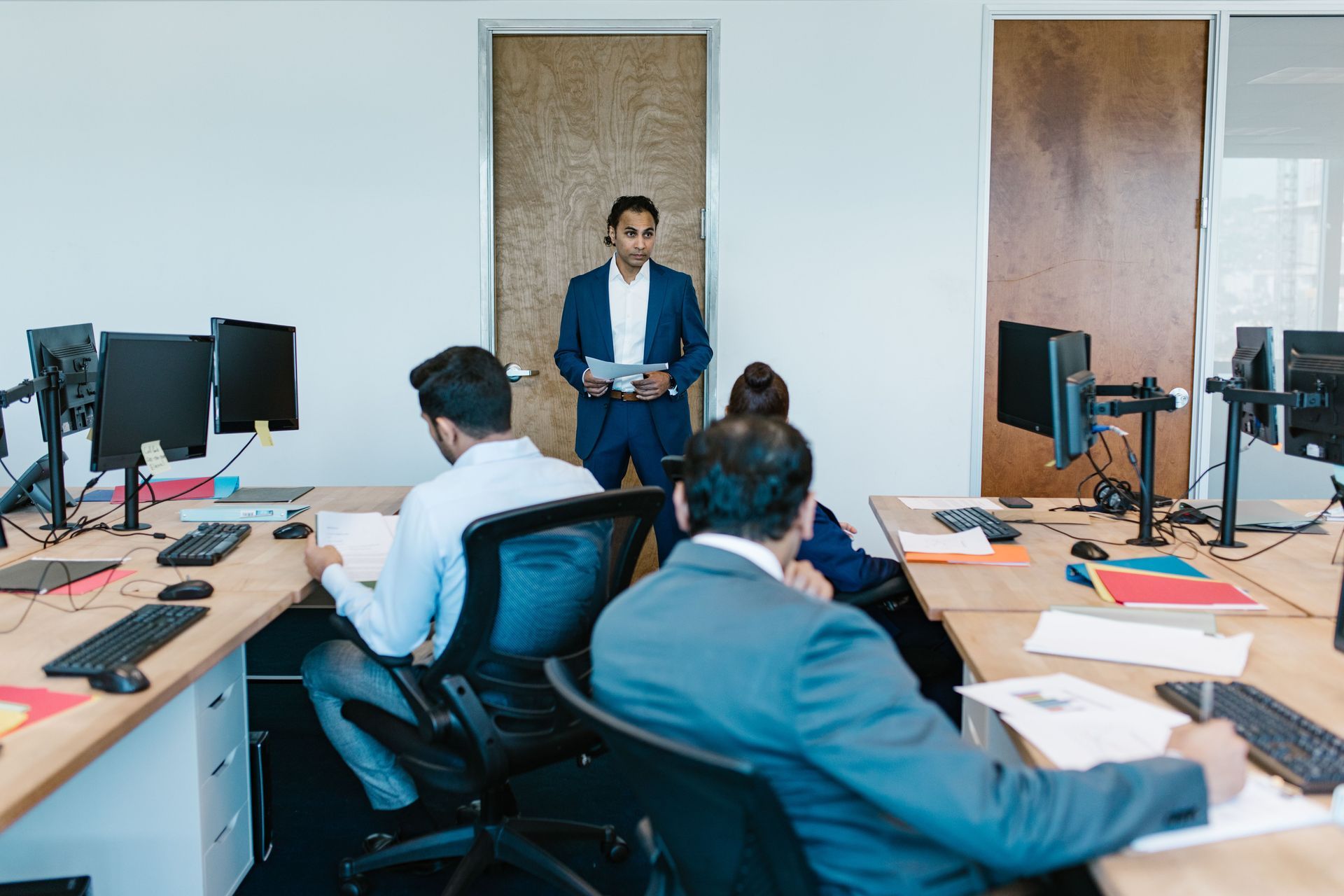 Founder reviewing a California LLC-to-corporation conversion checklist with legal and compliance doc