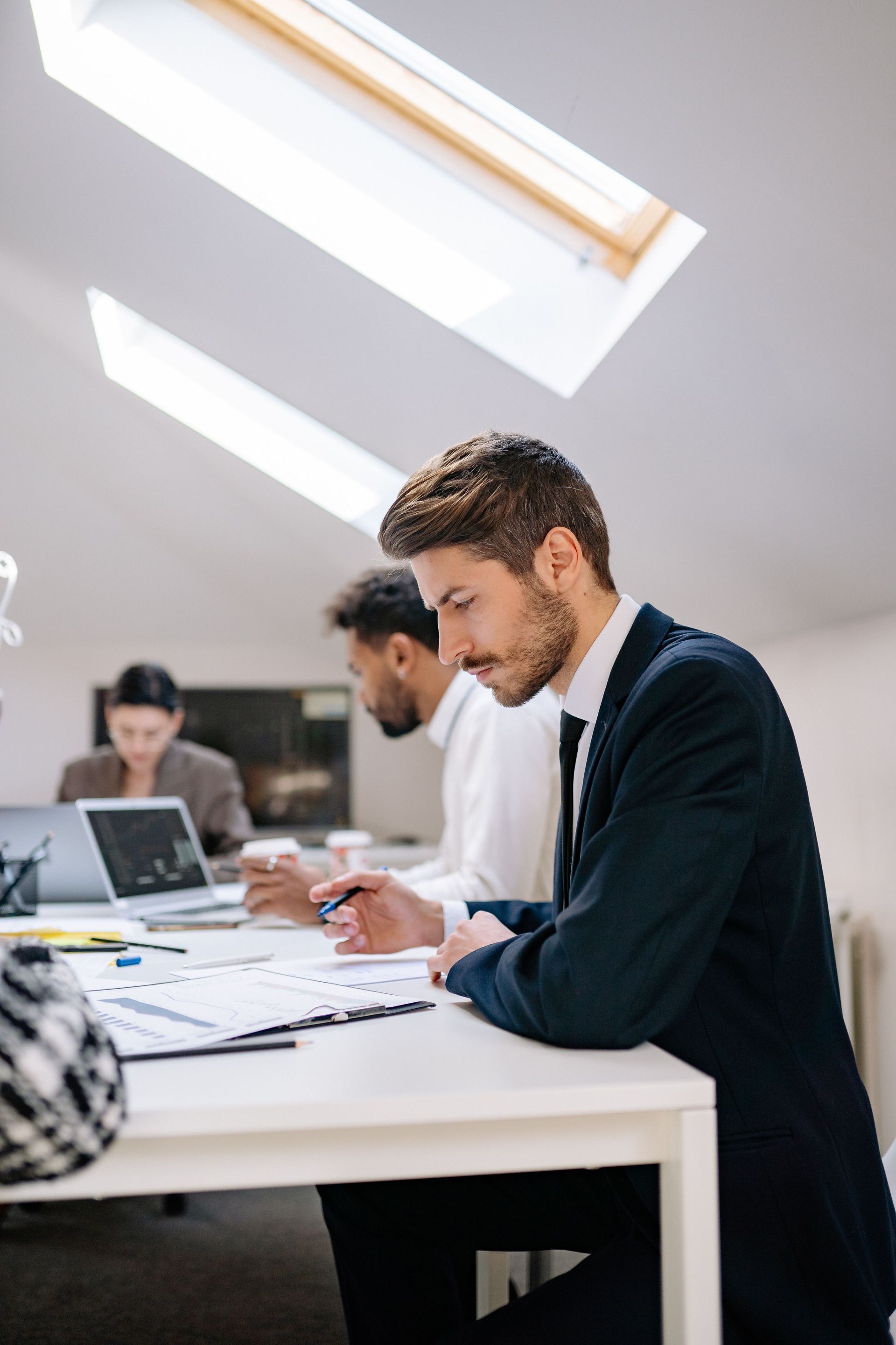 Investor reviewing private company secondary sale documents and ROFR agreement in San Francisco Bay