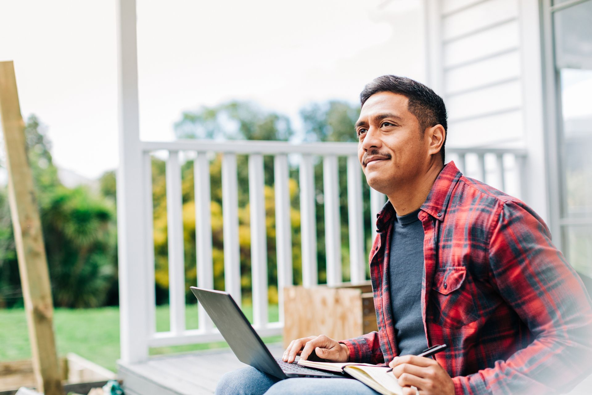 Man Sitting In Front Of His House — Christchurch, NZ — Money For You Mortgages