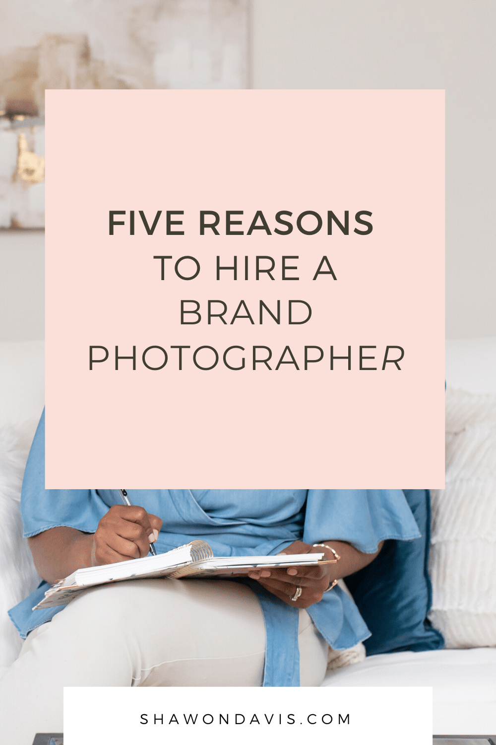 Pink graphic with text “Five Reasons to Hire a Brand Photographer” over a seated person writing on a clipboard