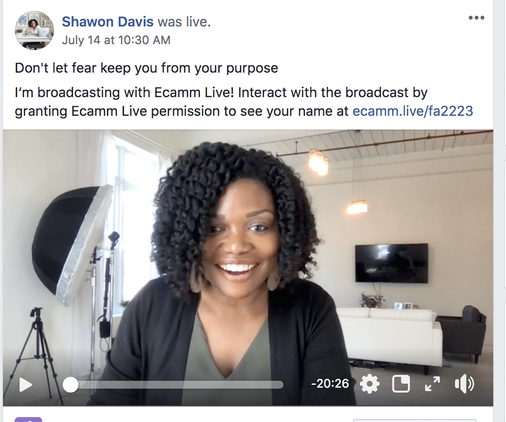 Smiling woman on a live video call in a modern room, with a message about joining the live broadcast.