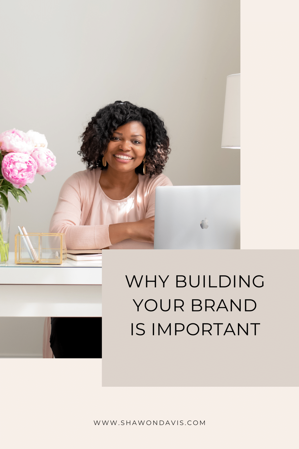Smiling woman at desk with laptop and flowers, text: “Why Building Your Brand Is Important”