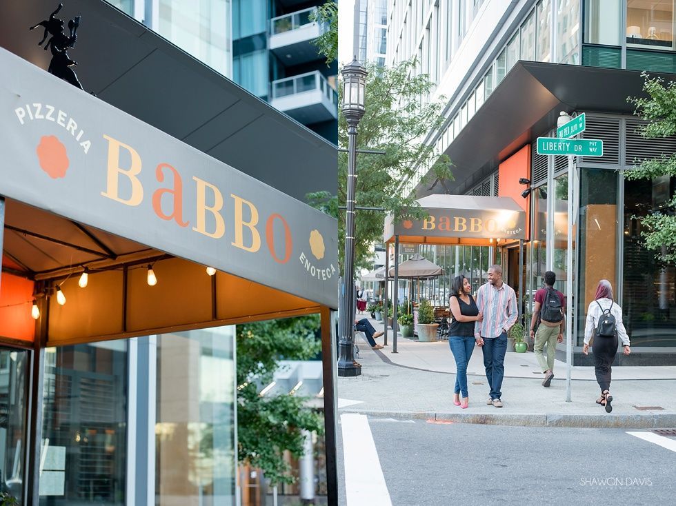 Street scene with pedestrians beside a Babbo restaurant awning in a city shopping district