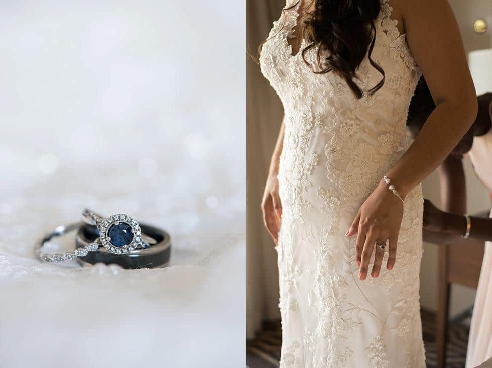 Wedding ring with blue gemstone beside a bride in a lace dress