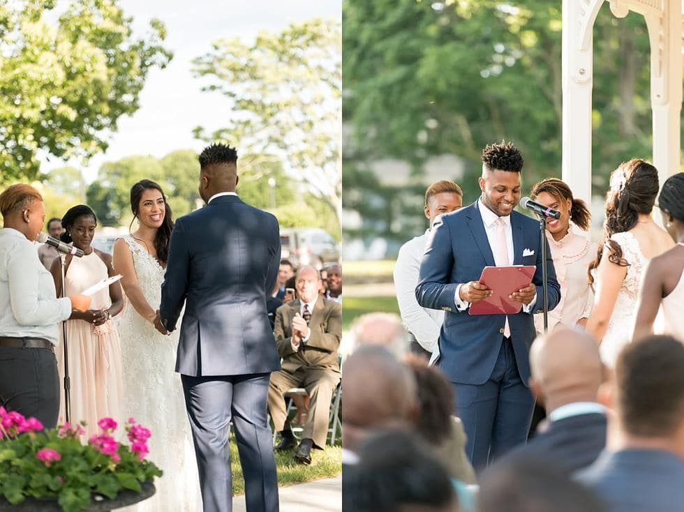 Outdoor wedding ceremony with officiant reading from a red book and guests seated nearby