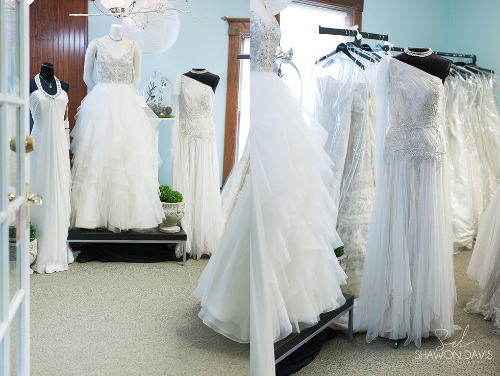 Bridal shop with white wedding dresses displayed on mannequins and racks