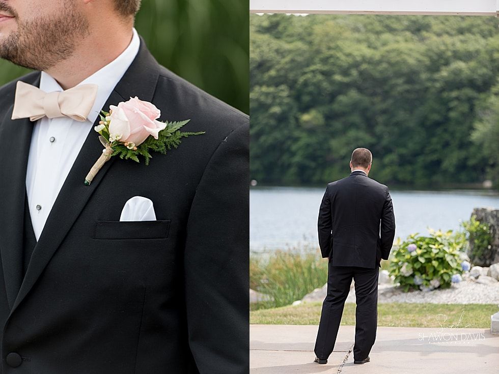 Man in a black tuxedo with pink boutonniere stands by a lakeside, with a smaller inset view from behind.