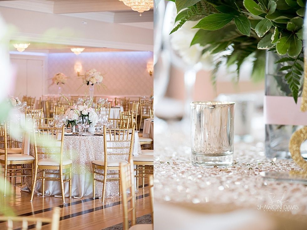 Elegant banquet hall with gold chairs, white floral centerpieces, and shimmering table settings